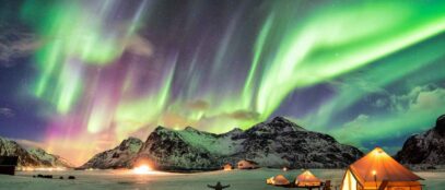 Man under Northern Lights and Aurora Borealis in top 10 countries to see the northern lights and aurora